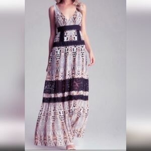 Stunning Bebe NWOT flowy maxi tired dress with lace details animal print…